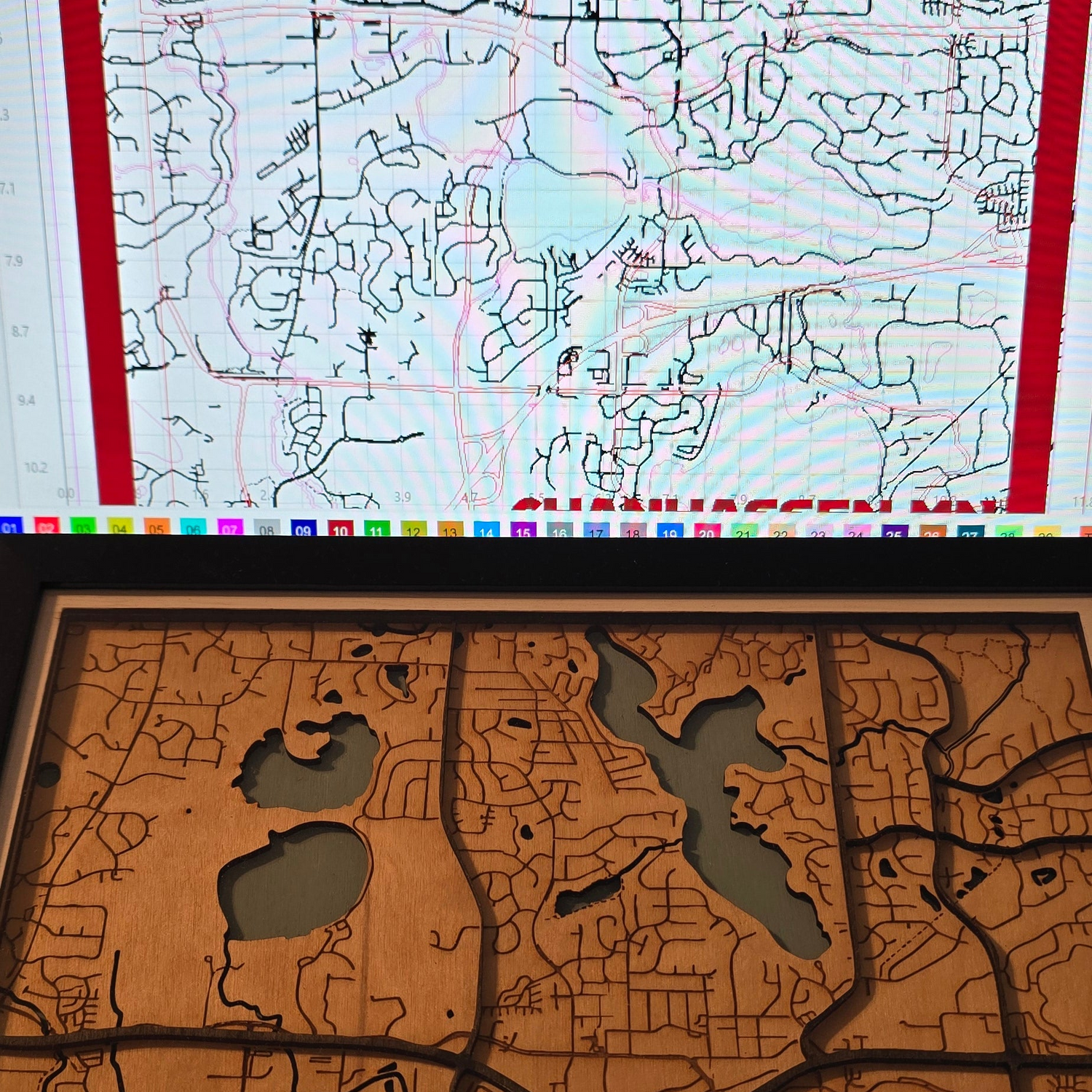 MN Laser & Designs technical wireframe map translated into high-detail laser-cut wooden masterpiece.